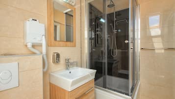 Shower, hair dryer, towels, soap