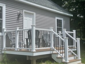 A house with a covered porch, white railings, and a wooden deck. - Troy House, Country Get Away, w fire-pit, rec & game rm, many small ponds nearby (Troy)