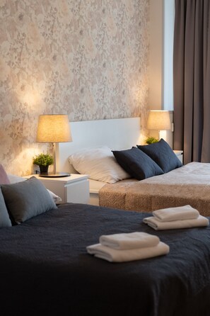 3 عدّة غرف نوم ومكواة/لوح كي وواي فاي مجانًا وملاءات أسرّة