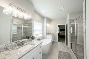 Bathtub, hair dryer, towels, soap