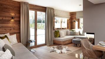 Deluxe Apartment | Living area | 55-inch flat-screen TV with cable channels, TV, fireplace