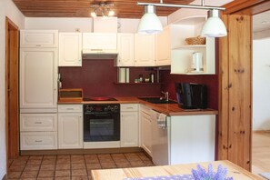 Fridge, stovetop, dishwasher, coffee/tea maker