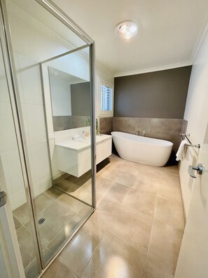 Bathtub, towels, toilet paper