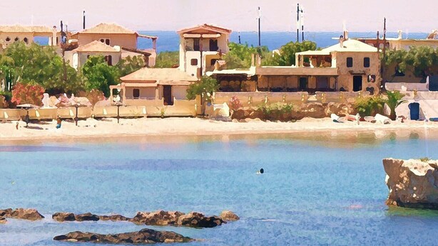 A coastal village with traditional architecture, clear blue waters, and rocky outcrops. - Sea View Holiday House (Archangelos)