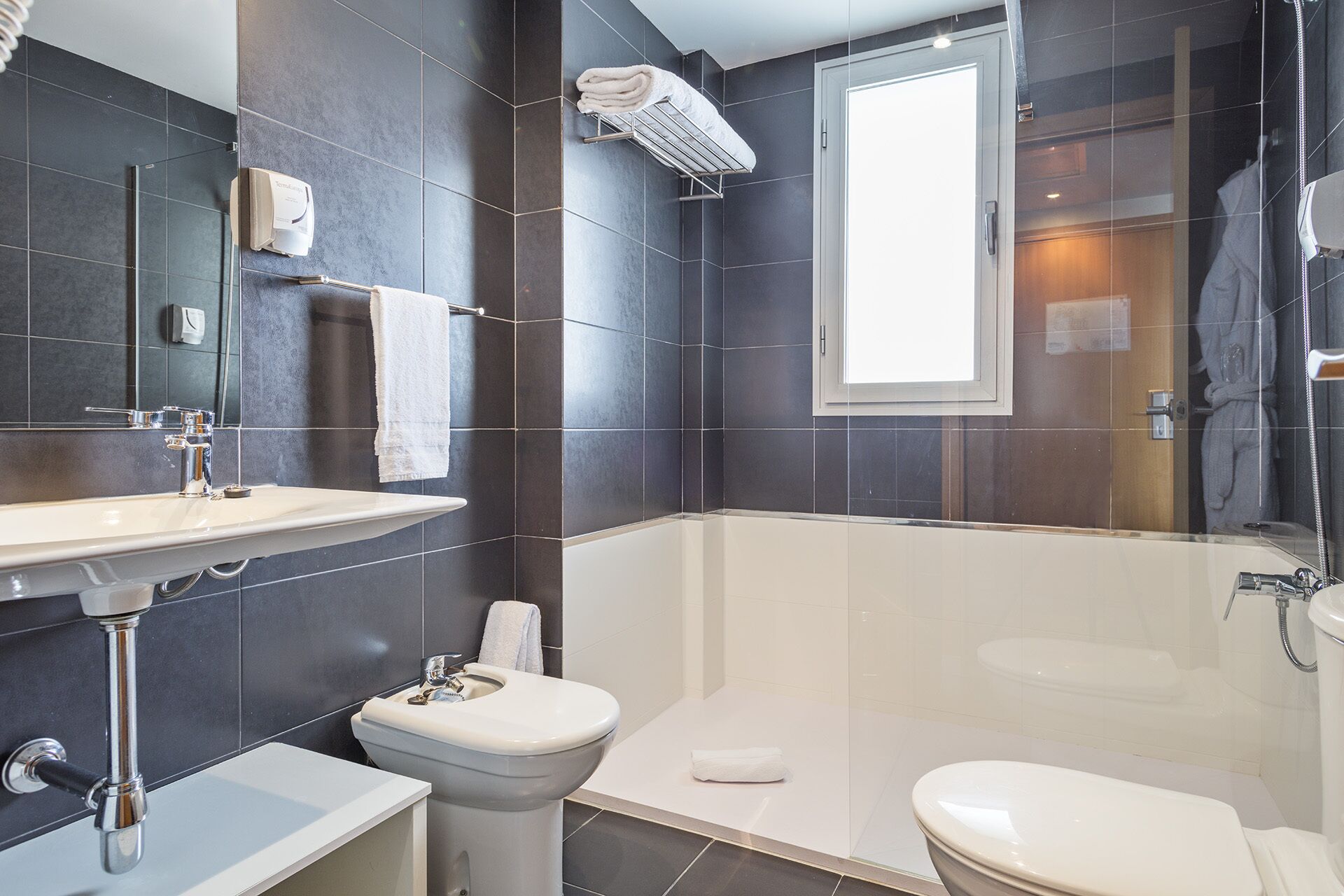 standard room | bathroom | hair dryer, towels, soap, shampoo