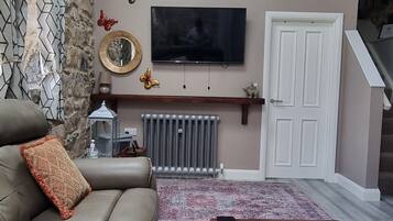 Cottage | Living area | 30-inch TV with digital channels