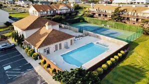 A residential area with a swimming pool, tennis courts, and a parking lot. - Superheat Retreat - Just 75 step to the beach. Breathtaking ocean view. (Kitty Hawk)