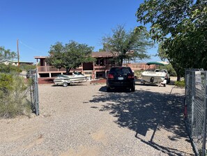 Property grounds - Captain's Quarters: Home on 1/2 acre, pets okay, circle drive, new Trex deck. (Elephant Butte)