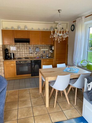 Fridge, stovetop, dishwasher, coffee/tea maker