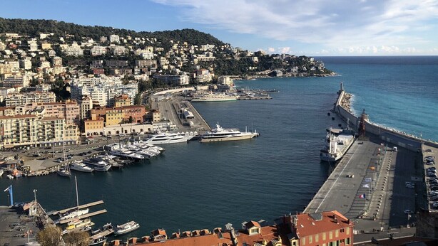 A coastal cityscape with a marina, buildings, and a hilly backdrop. - Very cosy villa with swimming pool 20 minutes from Nice (Drap)