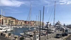 A marina with boats docked, a paved waterfront, and buildings in the background. - Very cosy villa with swimming pool 20 minutes from Nice (Drap)