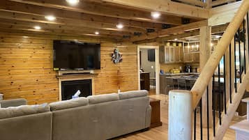 Smart TV, fireplace, books, stereo