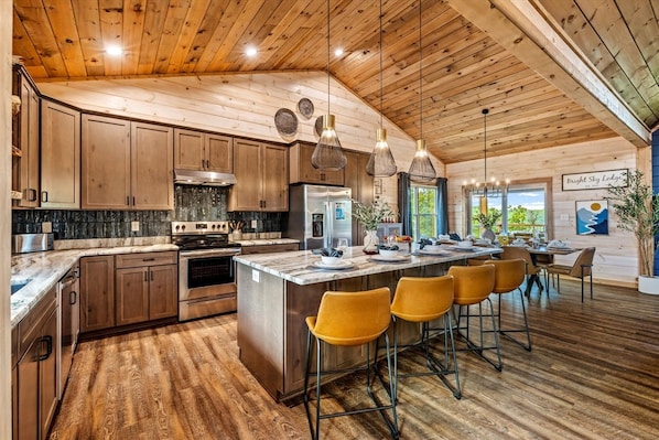 Gather around the island for breakfast, then cook for a crowd in a kitchen stocked with everything you need.