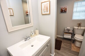 Bathtub, hair dryer, towels, soap