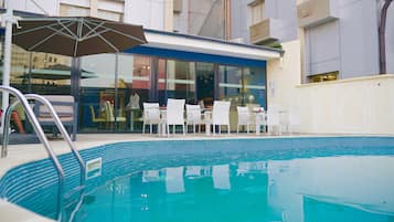 Indoor pool, outdoor pool, open 6:00 AM to 6:30 PM, pool umbrellas