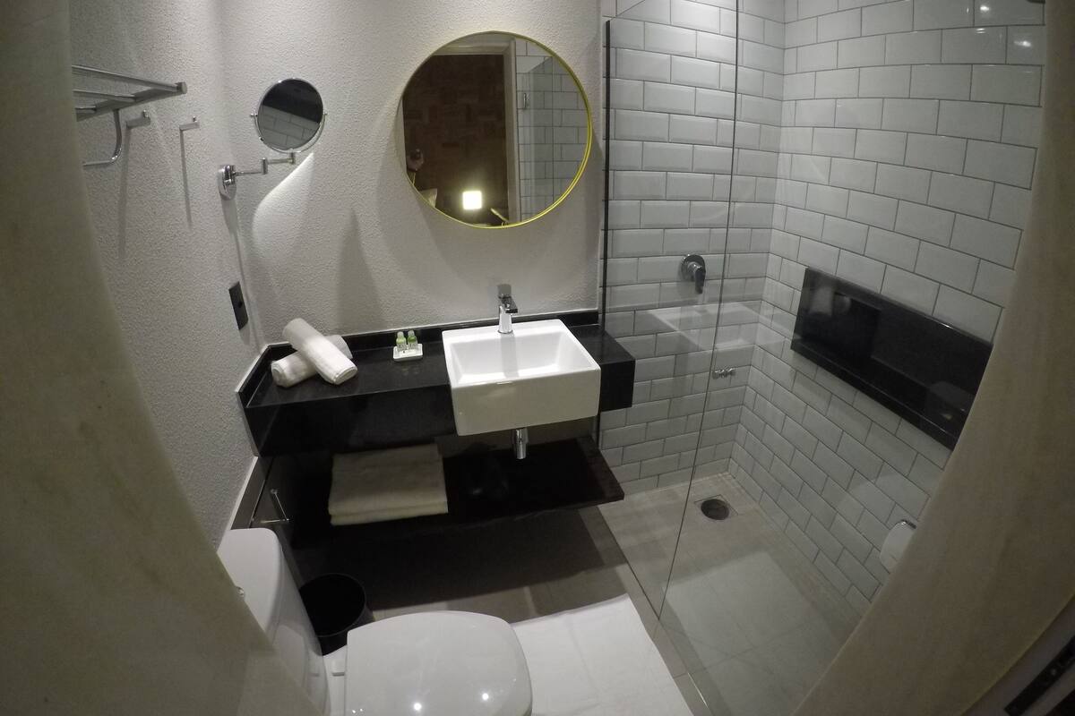 standard double room | bathroom | shower, rainfall showerhead, eco-friendly toiletries, hair dryer