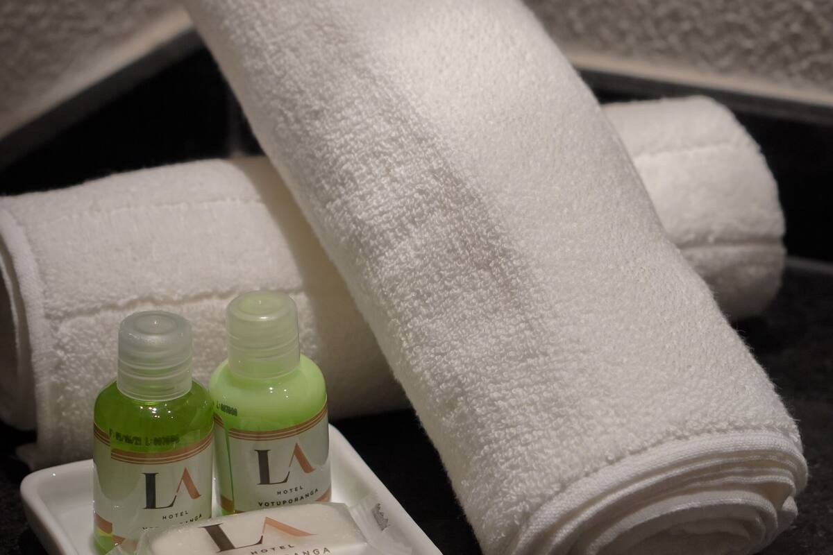 standard twin room | bathroom | shower, rainfall showerhead, eco-friendly toiletries, hair dryer