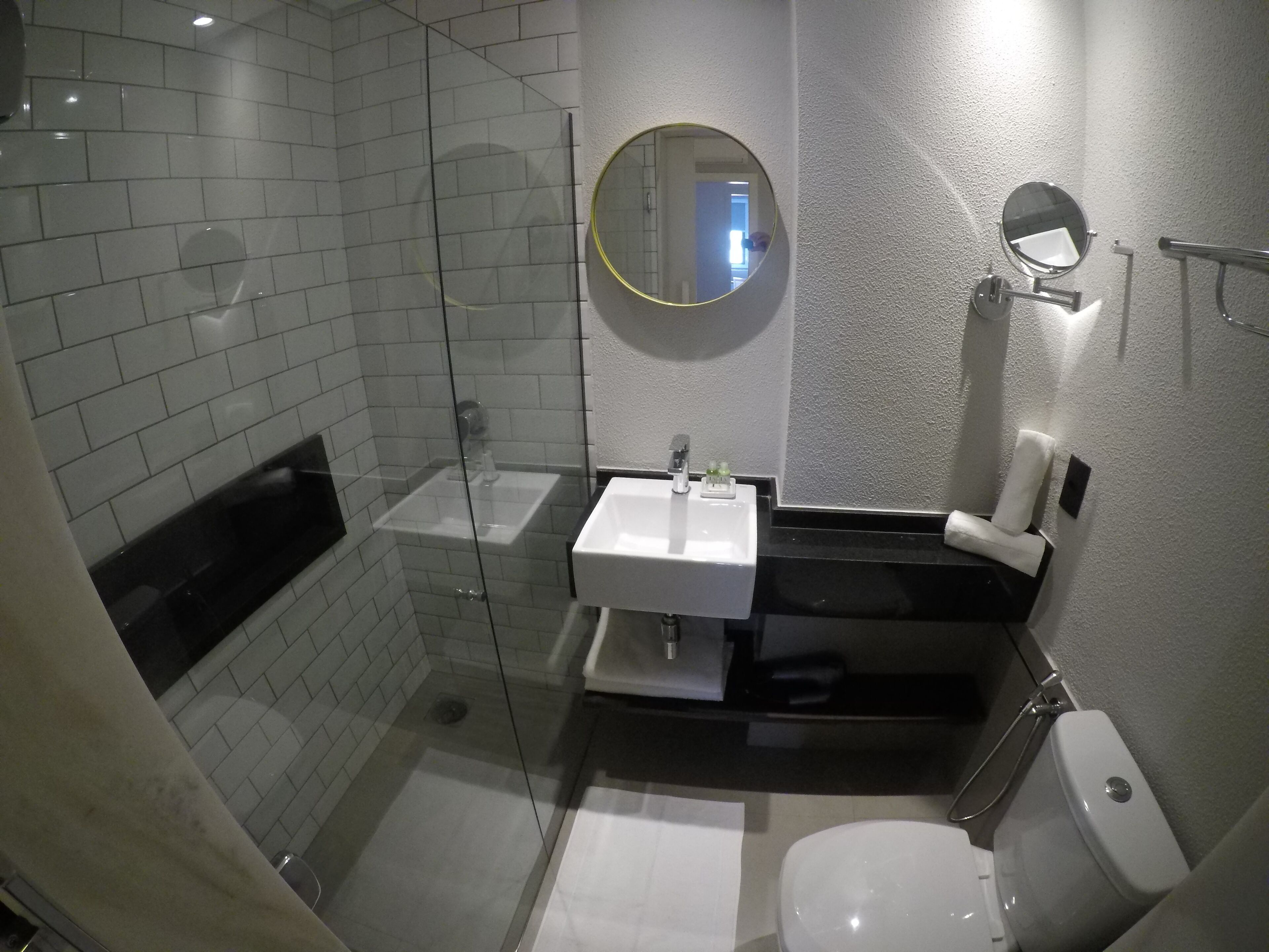 standard twin room | bathroom | shower, rainfall showerhead, eco-friendly toiletries, hair dryer