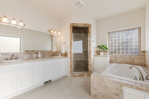 Combined shower/bathtub, hair dryer, towels, soap