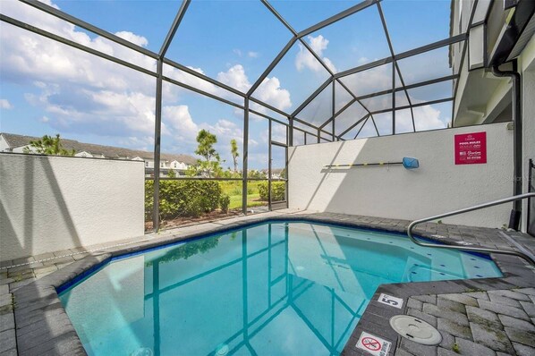 An indoor swimming pool with clear glass walls, a no diving sign, and a pool rules sign. - Captiva Delightful 5Br with Pool in Family Resort (Davenport)