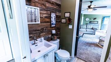 Combined shower/bathtub, towels, soap, toilet paper