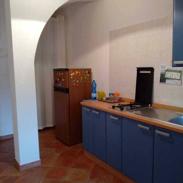 Fridge, cookware/dishes/utensils, dining tables