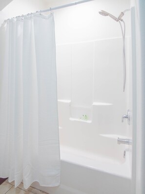 Combined shower/bathtub, hair dryer, towels, soap