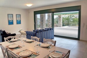 Family Villa | Living area | 40-inch Smart TV with satellite channels, TV - Ouzo Stone House 1, with private pool (Lesvos)