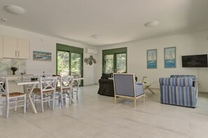 Family Villa | Living area | 40-inch Smart TV with satellite channels, TV - Ouzo Stone House 1, with private pool (Lesvos)