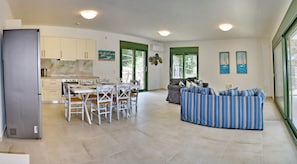 Family Villa | Living area | 40-inch Smart TV with satellite channels, TV - Ouzo Stone House 1, with private pool (Lesvos)