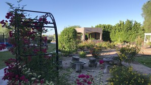 A garden with a pergola, various plants, and a gazebo. - Luxury Casita at Desert Estate in Scottsdale (Scottsdale)