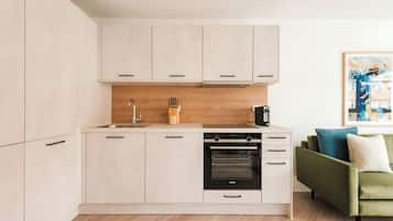 Full-sized fridge, oven, cookware/dishes/utensils