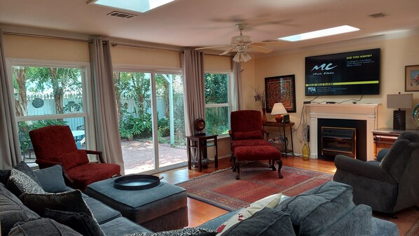 Smart TV, fireplace, books, printers