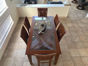 Enjoy meals in this stylish dining area with a beautifully set table and comfortable seating for six.