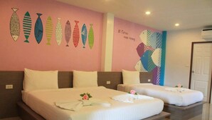 A hotel room with two beds, a pink wall with fish artwork, and a mural of a woman. - Fahsai Hotel Aonang (Krabi)
