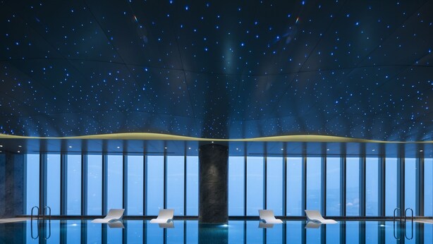 A swimming pool with a starry ceiling and large windows. - Nanjing Golden Eagle International (Nanjing)