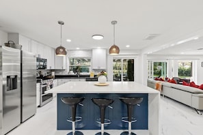 Large Calacata Island overlooking the Dining area 