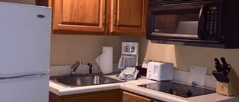 Microwave, coffee/tea maker, toaster, cookware/dishes/utensils