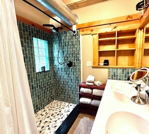Shower, hair dryer, towels, soap