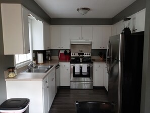 Coffee/tea maker, fridge, microwave, oven