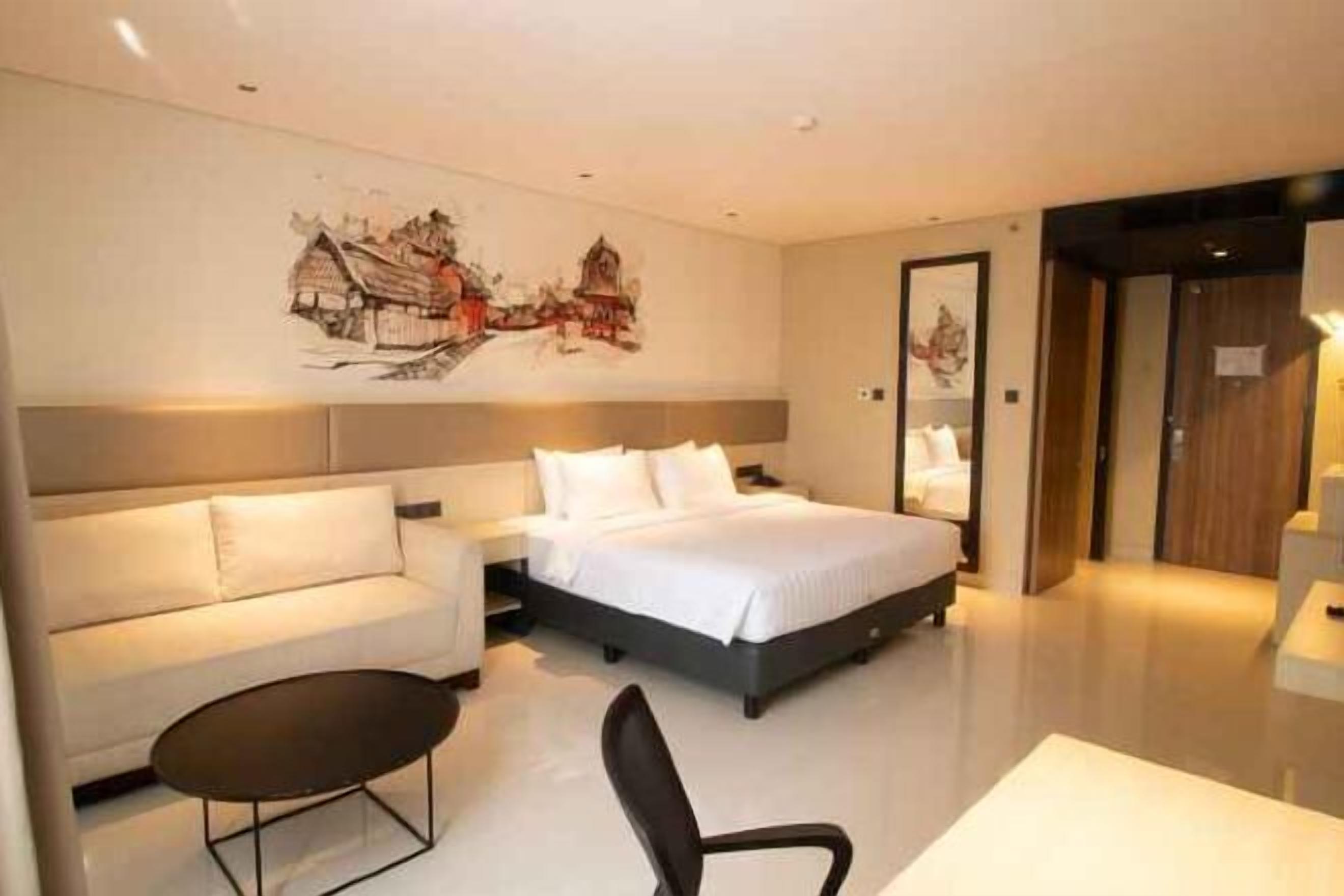 In-room safe, desk, laptop workspace, bed sheets