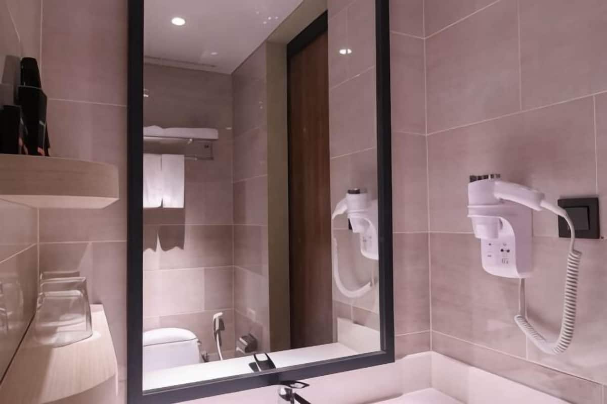 Shower, hair dryer, slippers, towels