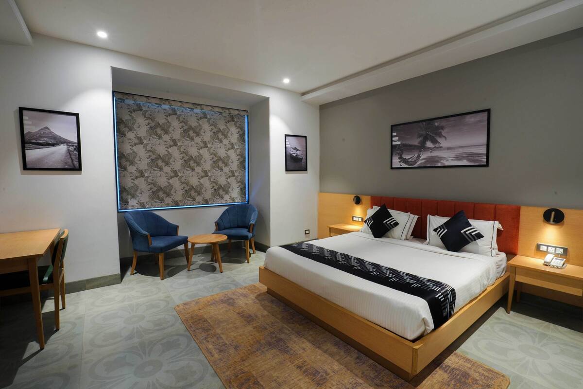 Spacious Deluxe Room | Desk, iron/ironing board, rollaway beds (free), bed sheets