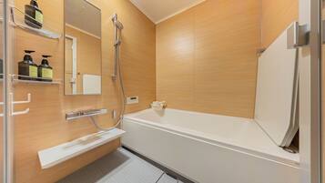 Bathtub, hair dryer, towels, soap