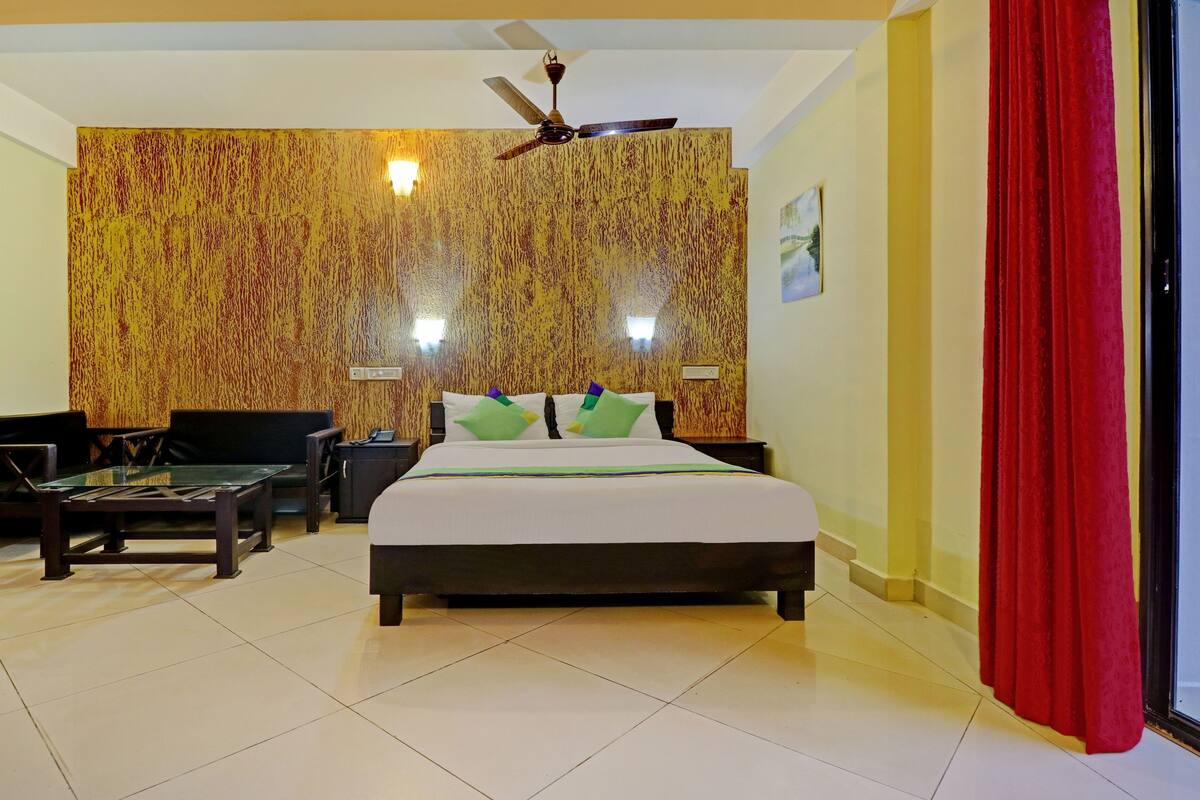 Desk, iron/ironing board, bed sheets
