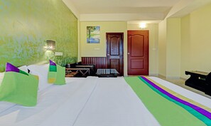 Desk, iron/ironing board, bed sheets