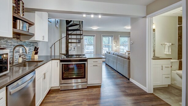 A modern kitchen with a built-in oven, stainless steel appliances, and a wooden countertop. - A Ridge above the Rest!  New Remodel and High End Upgrades (Breckenridge)