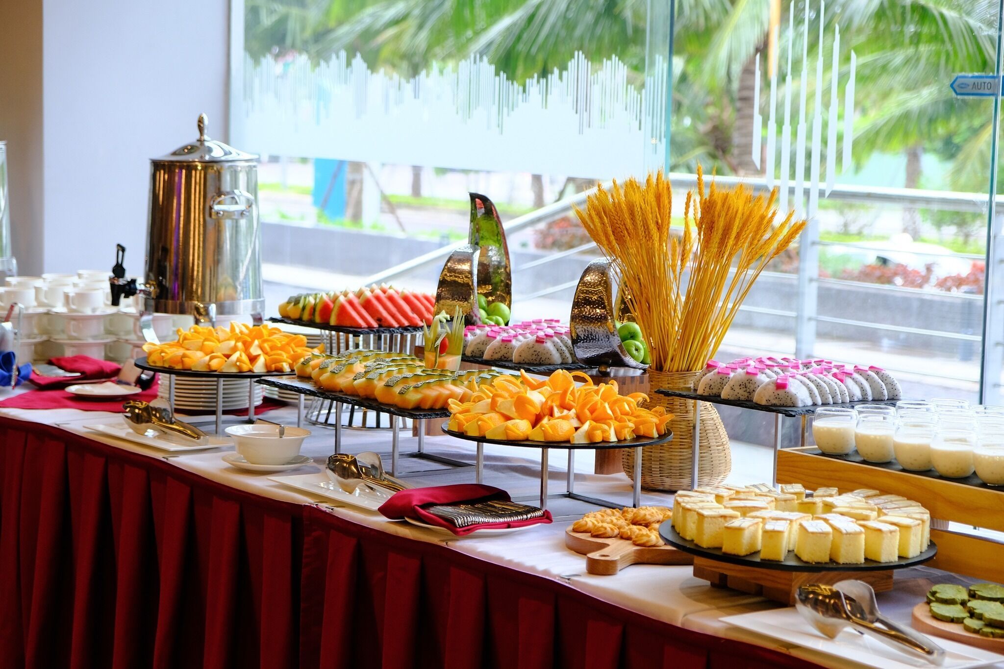 A buffet with various food items and a coffee station.