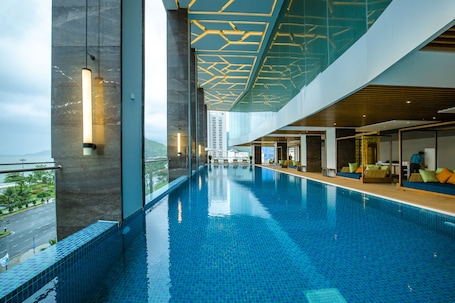 Indoor pool, outdoor pool, sun loungers. FLC City Hotel Beach Quy Nhon
