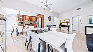 A spacious kitchen with modern appliances and wooden cabinets.
